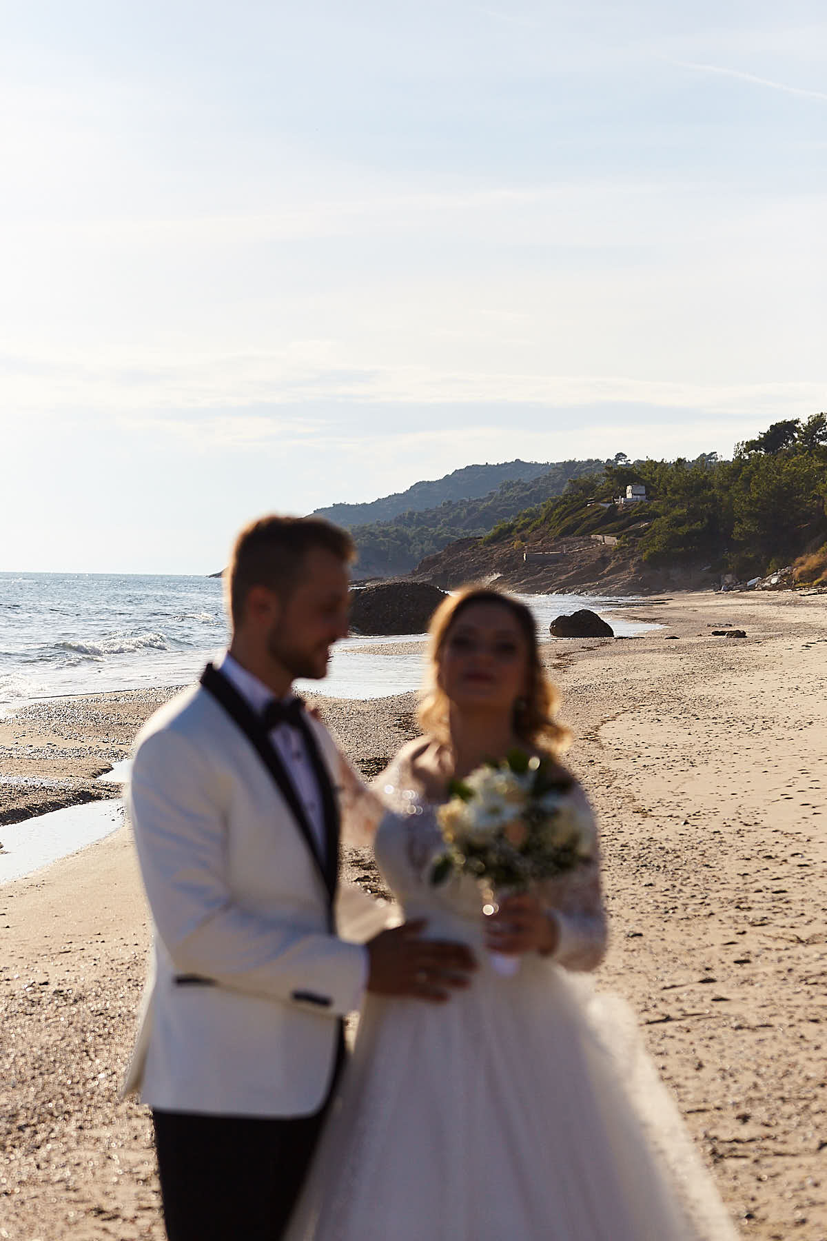 groom and bride at the beach