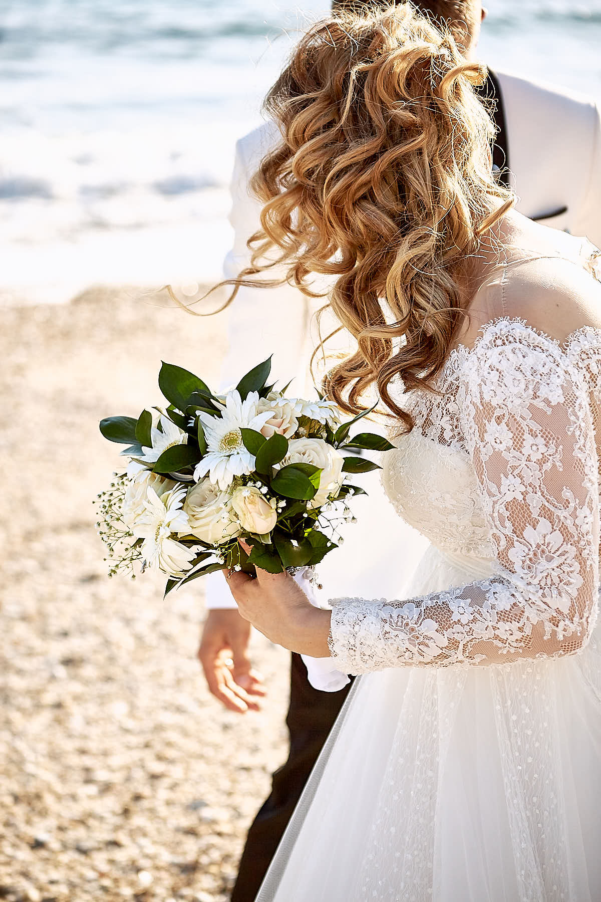 Bride side, holding bouquet