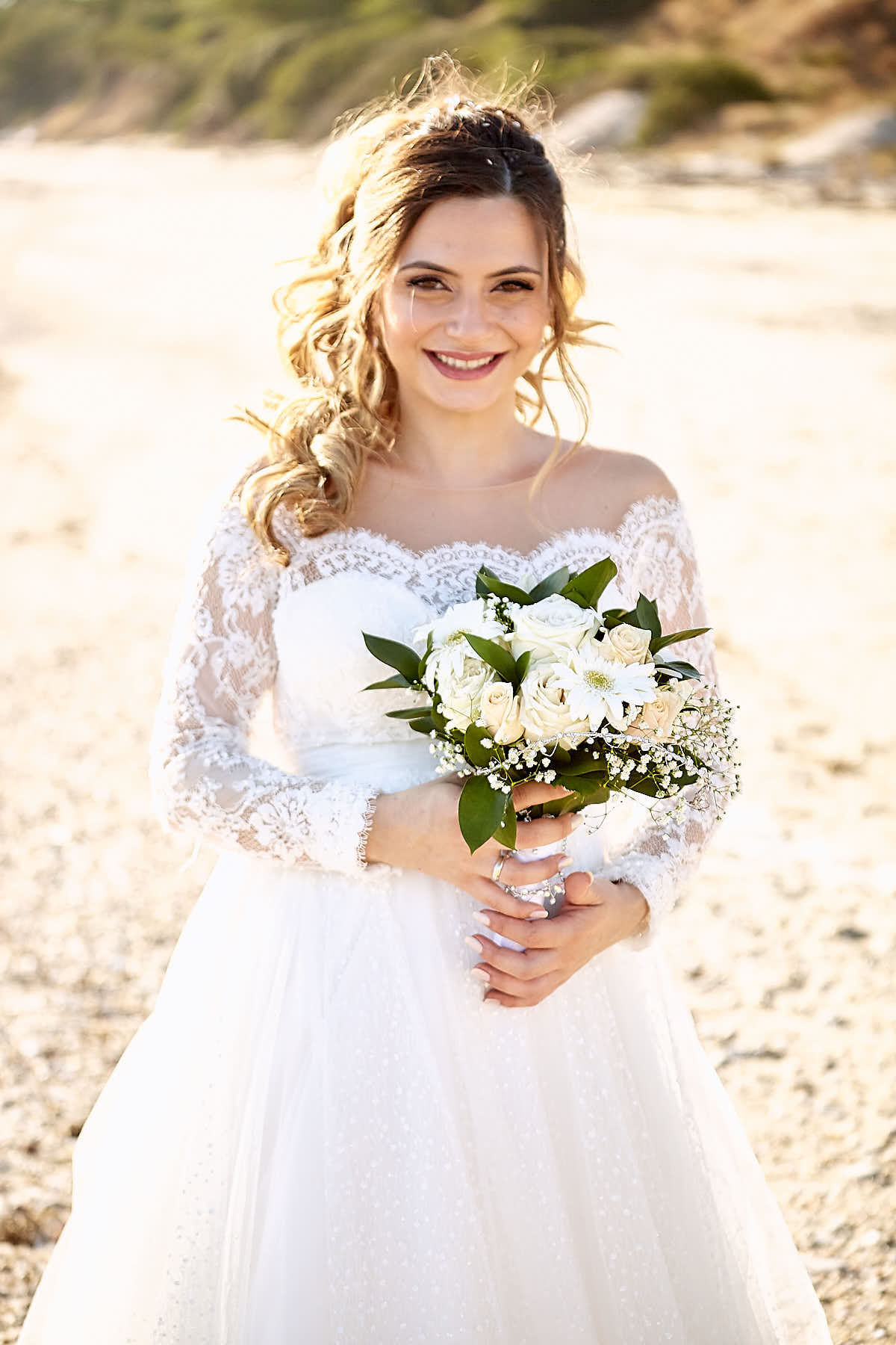 bride holding flowers, sun illuminating her hair in golden hues