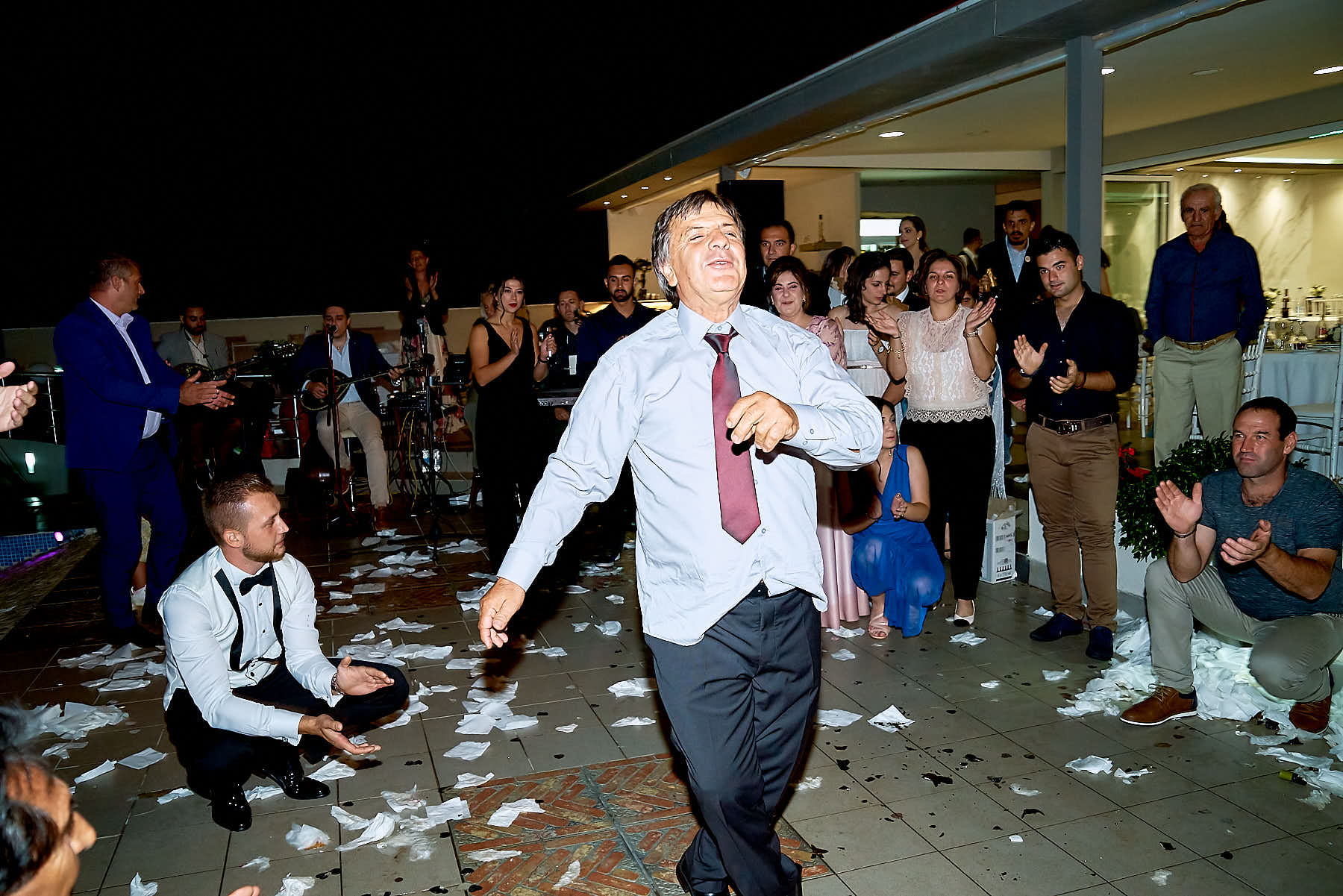 man dancing at wedding ball and people enjoying him and clapping
