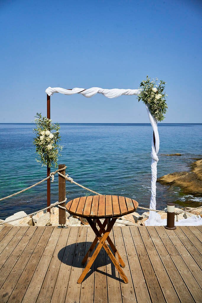 Beach wedding arch with white flowers