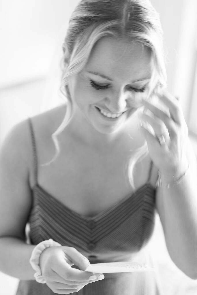 Bride reading letter closeup