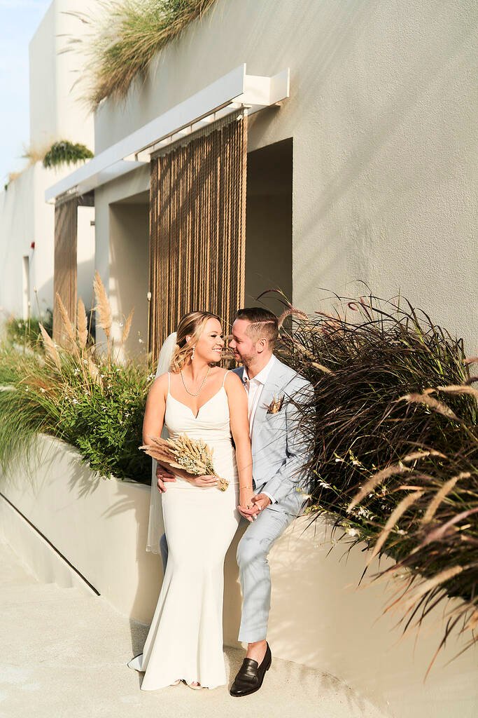 Couple sitting by greenery