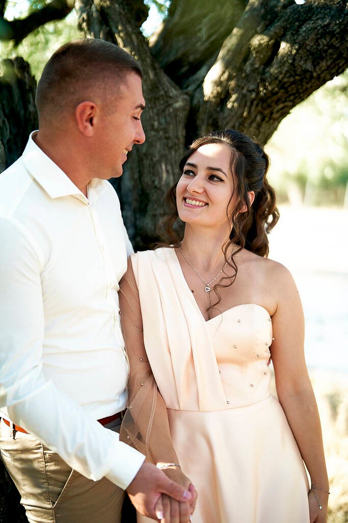 Groom behind bride laughing