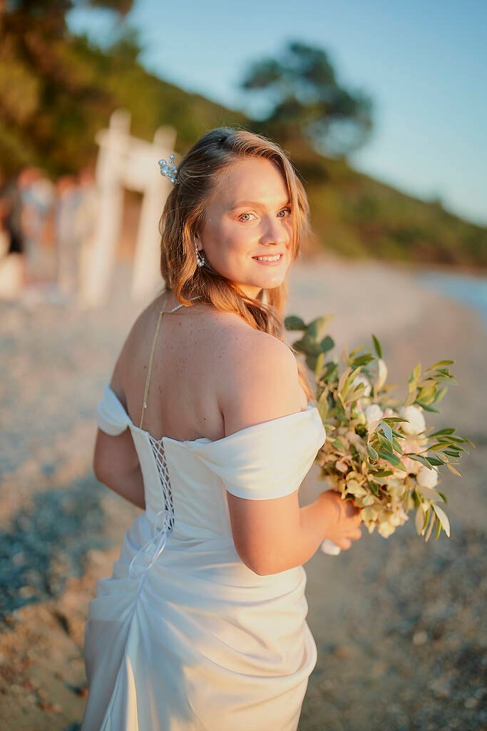 couple laughing beach wedding