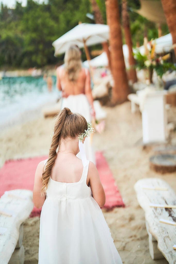 Bride and groom beach walk