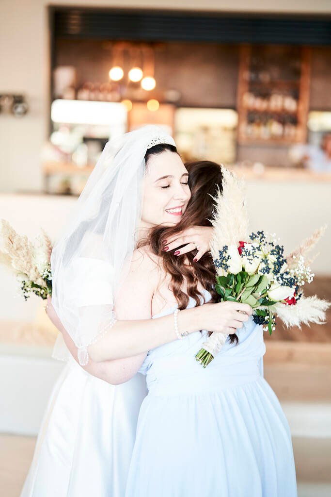 Bride laughing with guests