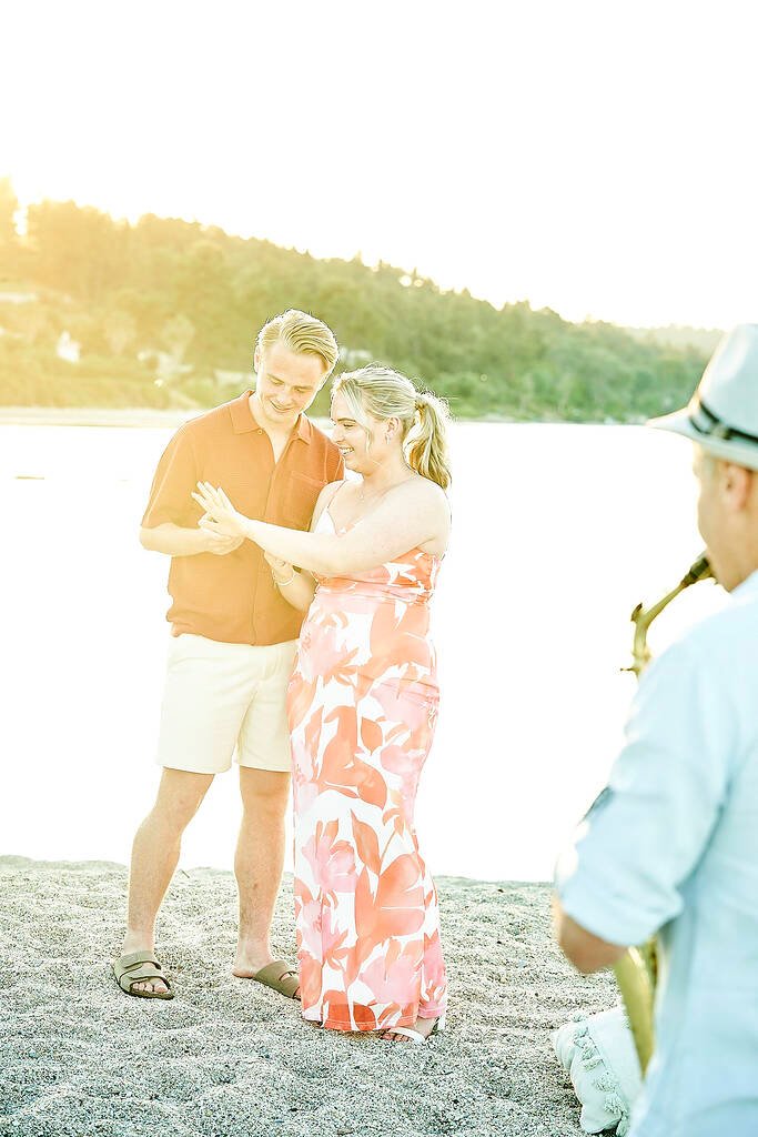 couple hugging after proposal moment