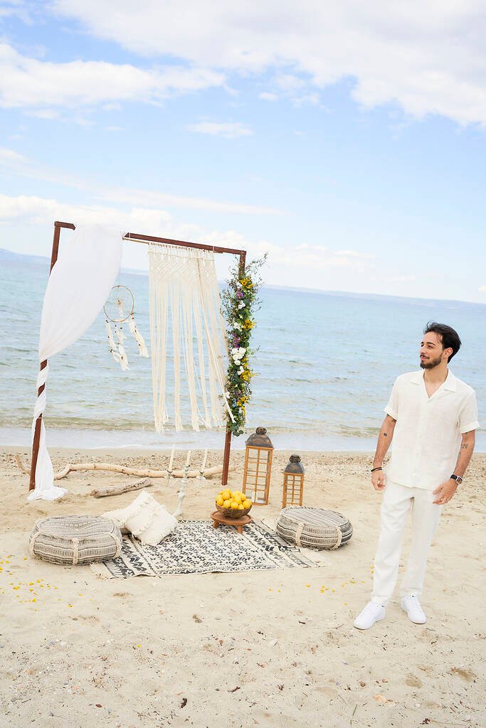 Candid moment during beach proposal Polychrono Greece
