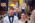 best man wearing the crowns at the couple, bride smiling, groom looking towards her