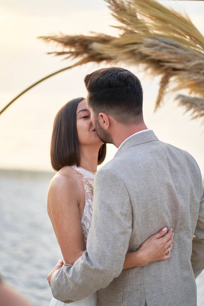 Bride and groom kiss